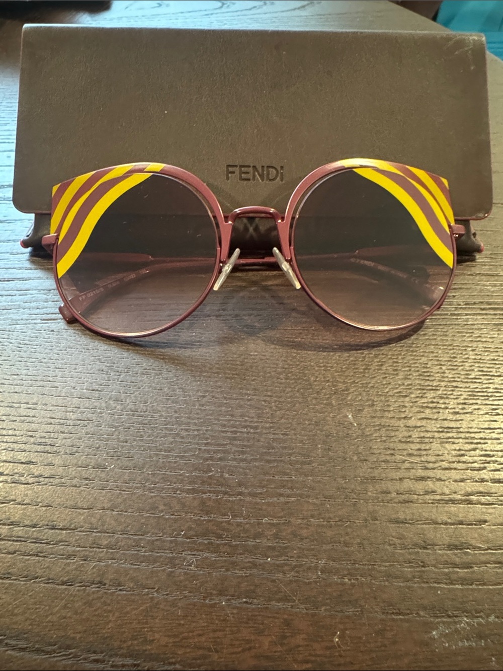 Fendi Women's Burgundy Round Sunglasses with Yellow Accent